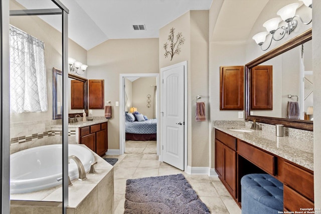 534 Mission Hill Run, New Braunfels, TX 78132 - ensuite bathroom with lofted ceiling, tile patterned floors, visible vents, vanity, and a garden tub