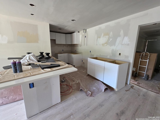 kitchen featuring white cabinetry and light wood finished floors