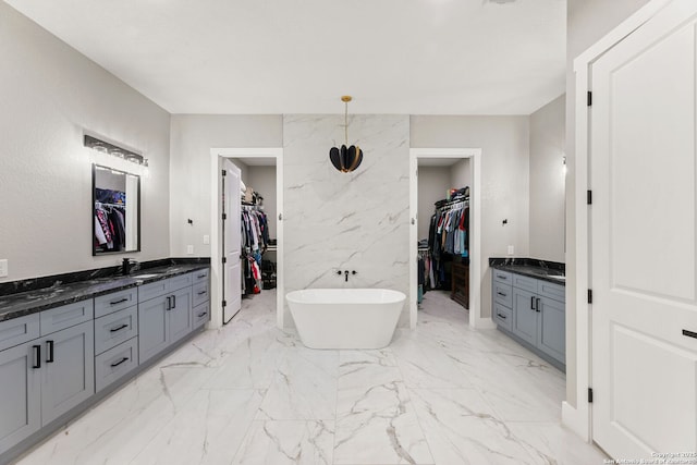 1191 Glenwood, Bulverde, TX 78163 - full bath featuring marble finish floor, a walk in closet, a soaking tub, and vanity