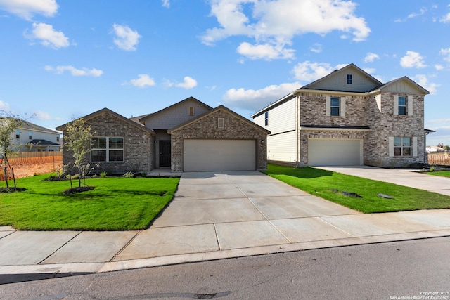 view of front of home with concrete driveway, fence, and a front yard