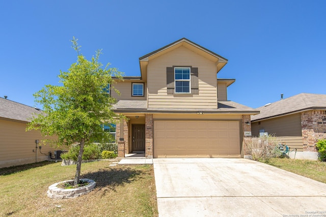 traditional-style home featuring a garage, concrete driveway, a front yard, and brick siding