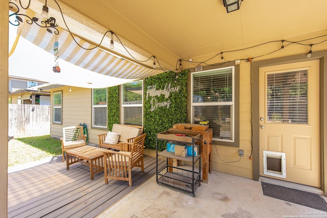 deck with fence and an outdoor living space