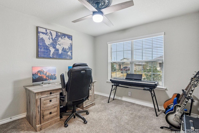 office area with baseboards, carpet floors, and ceiling fan