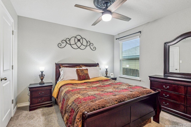 bedroom with carpet flooring, baseboards, and ceiling fan
