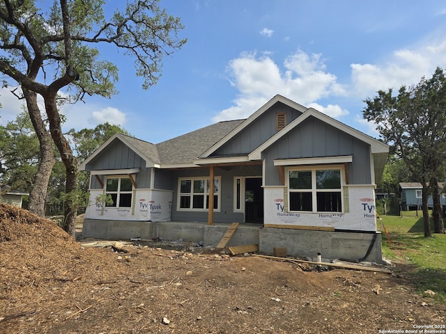 property under construction featuring board and batten siding