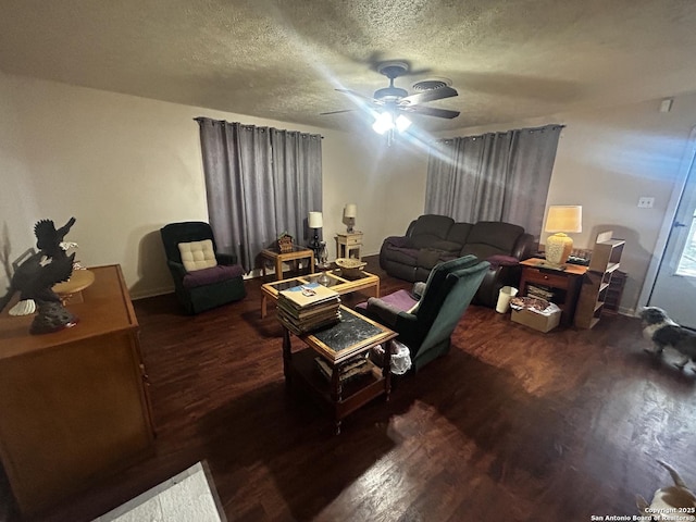 living room featuring wood finished floors, a textured ceiling, and a ceiling fan