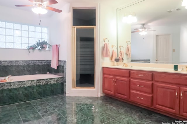 full bathroom with double vanity, a stall shower, visible vents, ceiling fan, and a garden tub