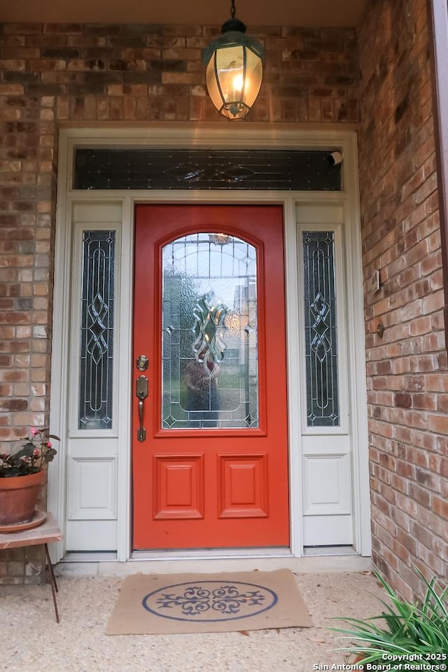 entrance to property with brick siding