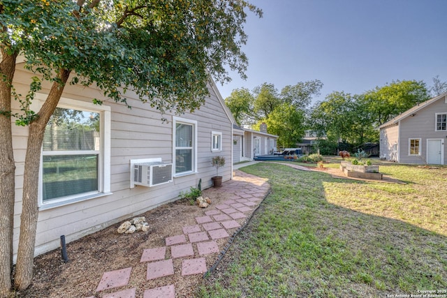 view of yard featuring cooling unit and a patio area