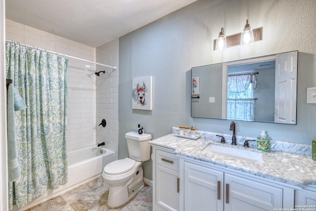 bathroom with a textured wall, shower / bath combo with shower curtain, toilet, and vanity