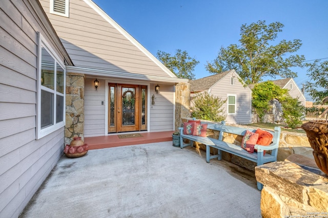 entrance to property with a patio area