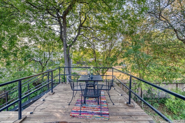 wooden deck with outdoor dining space