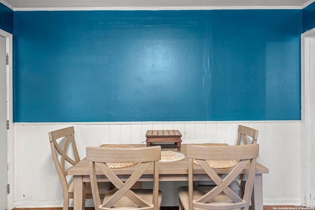 dining room featuring wainscoting and ornamental molding