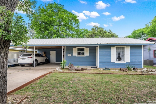 single story home with driveway, a front lawn, metal roof, and an attached carport