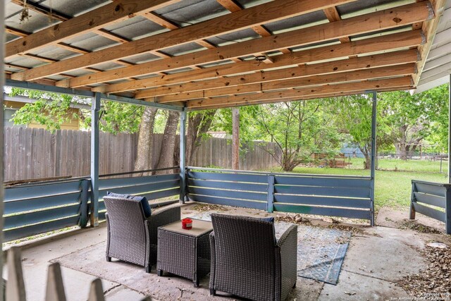 view of patio featuring fence