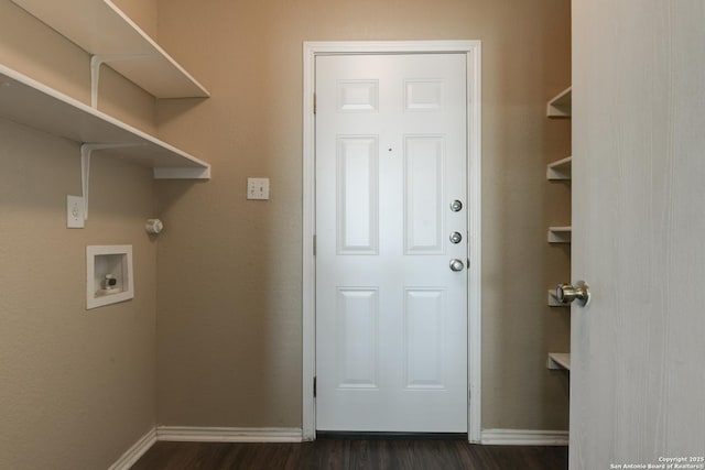 laundry room featuring dark wood-style floors, washer hookup, and baseboards