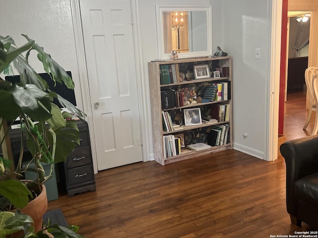 sitting room with wood finished floors and baseboards