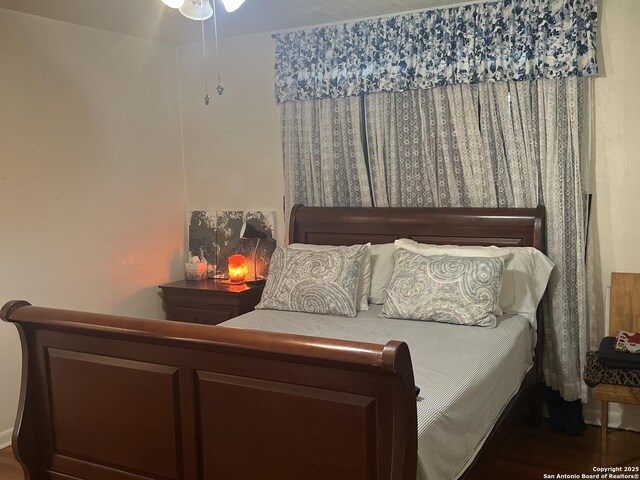 bedroom featuring wood finished floors