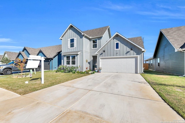 view of front of home with concrete driveway, an attached garage, board and batten siding, and a front yard