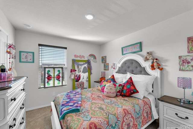 carpeted bedroom with baseboards