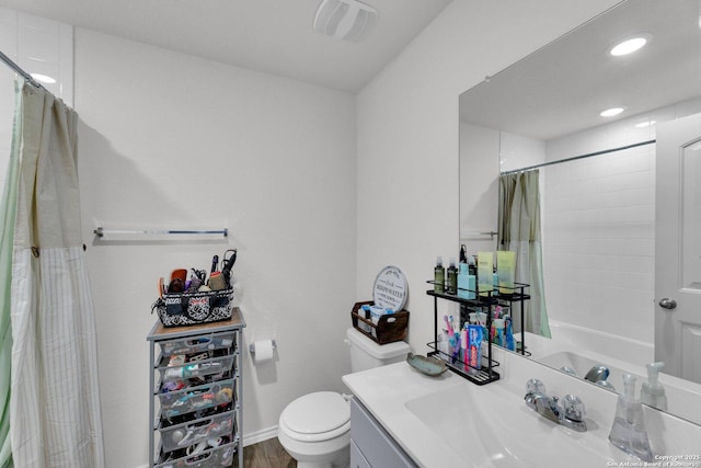 bathroom featuring recessed lighting, visible vents, toilet, vanity, and shower / tub combo with curtain