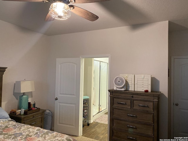 bedroom featuring a ceiling fan and wood finished floors