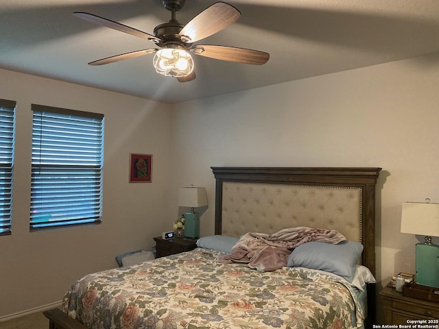 bedroom featuring baseboards, carpet flooring, and ceiling fan