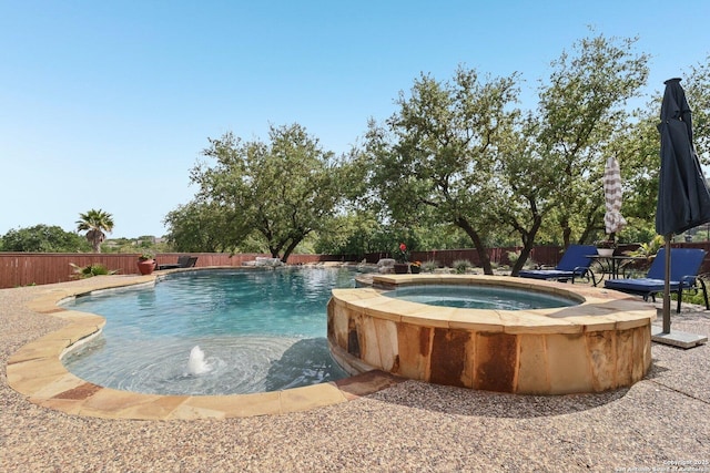 518 Ruidosa Downs, Helotes, TX 78023 - view of swimming pool featuring a pool with connected hot tub and a fenced backyard