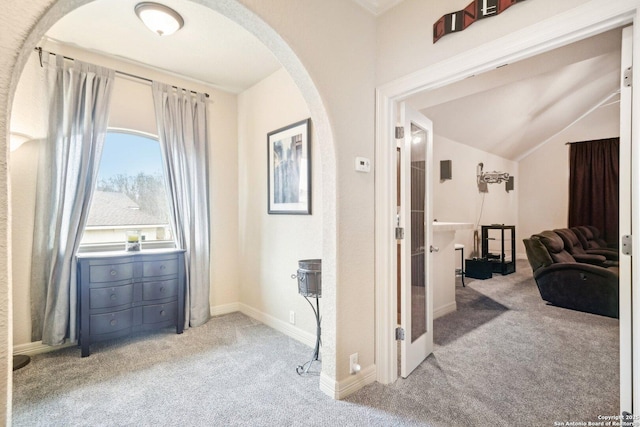 518 Ruidosa Downs, Helotes, TX 78023 - hallway featuring arched walkways, vaulted ceiling, carpet floors, and baseboards