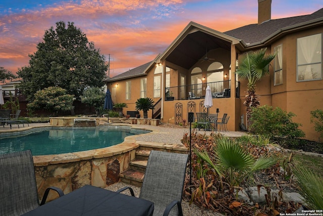 518 Ruidosa Downs, Helotes, TX 78023 - pool at dusk with an outdoor pool, a patio area, and ceiling fan