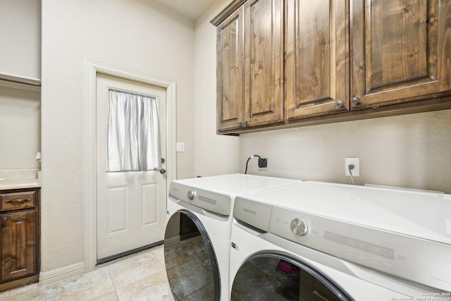 518 Ruidosa Downs, Helotes, TX 78023 - laundry room featuring washing machine and dryer, baseboards, and cabinet space