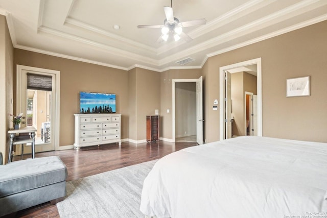 518 Ruidosa Downs, Helotes, TX 78023 - bedroom featuring dark wood finished floors, a tray ceiling, visible vents, a ceiling fan, and crown molding