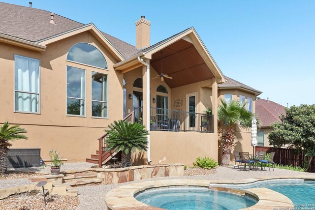 518 Ruidosa Downs, Helotes, TX 78023 - rear view of house with a chimney, a ceiling fan, fence, a patio, and stucco siding