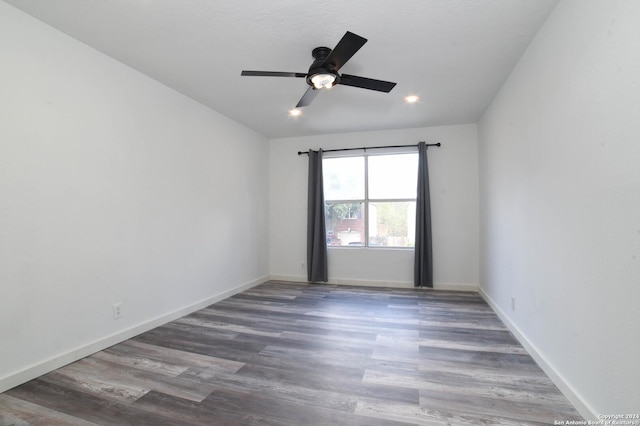 empty room featuring recessed lighting, wood finished floors, baseboards, and ceiling fan