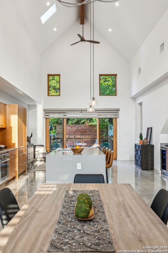 611 Simple Way, San Antonio, TX 78209 - interior space featuring high vaulted ceiling, plenty of natural light, and a skylight