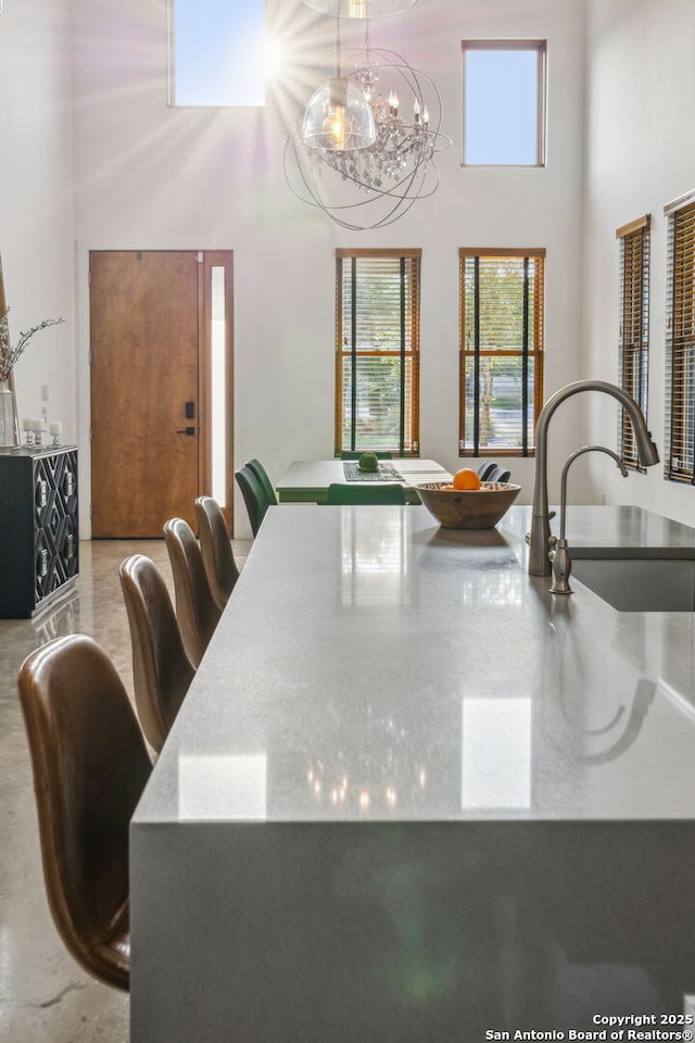 611 Simple Way, San Antonio, TX 78209 - dining space featuring a high ceiling and a chandelier