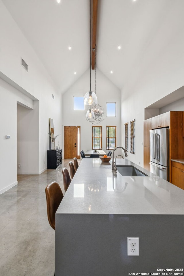 611 Simple Way, San Antonio, TX 78209 - kitchen featuring a sink, high end refrigerator, beam ceiling, finished concrete floors, and high vaulted ceiling