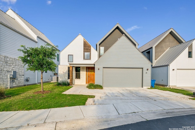 611 Simple Way, San Antonio, TX 78209 - view of front facade with an attached garage, driveway, and a front yard