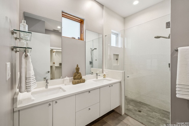 611 Simple Way, San Antonio, TX 78209 - full bath featuring double vanity, tile patterned flooring, tiled shower, and a sink