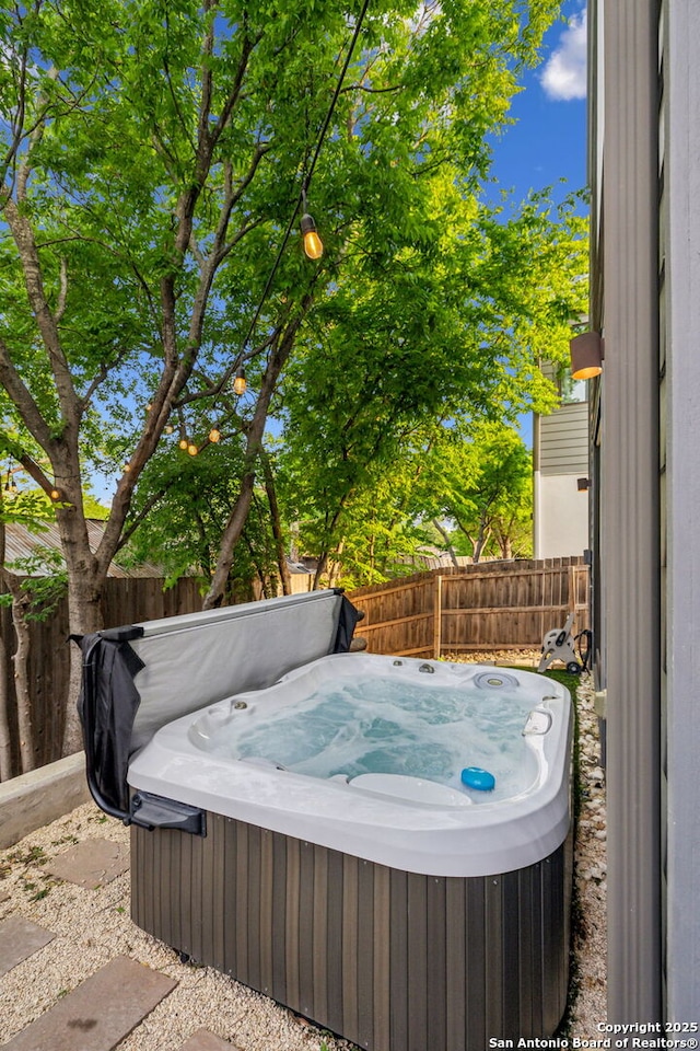 611 Simple Way, San Antonio, TX 78209 - exterior space with a hot tub and a fenced backyard