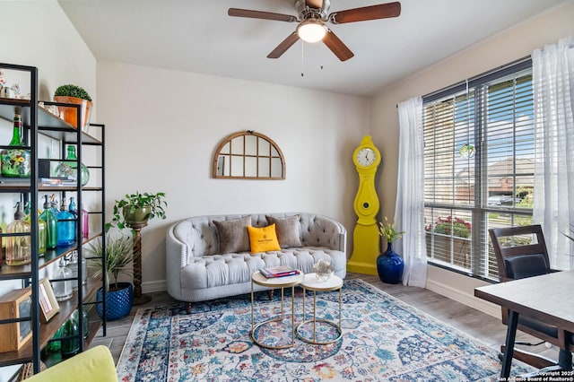 5112 Arrow Rdg, Schertz, TX 78154 - living room featuring wood finished floors, ceiling fan, and baseboards