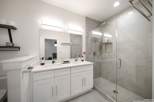 2114 Village, San Antonio, TX 78251 - full bath with tile patterned floors, a sink, and a shower stall