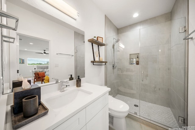 2114 Village, San Antonio, TX 78251 - full bathroom featuring a shower stall, ensuite bathroom, vanity, ceiling fan, and toilet