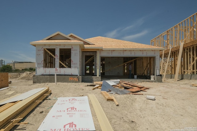 15451 Jake Xing, San Antonio, TX 78245 - rear view of property with an attached garage and a shingled roof