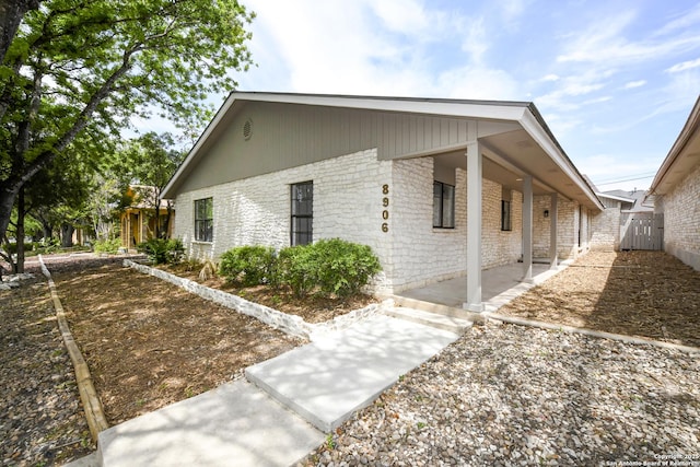 view of home's exterior with brick siding