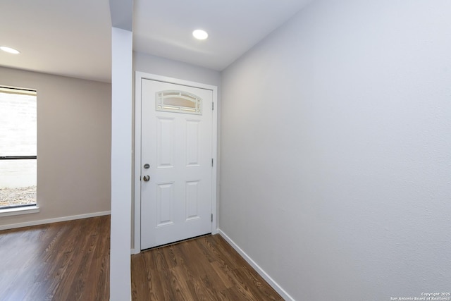 doorway with recessed lighting, dark wood finished floors, and baseboards