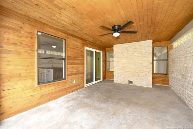view of patio featuring ceiling fan