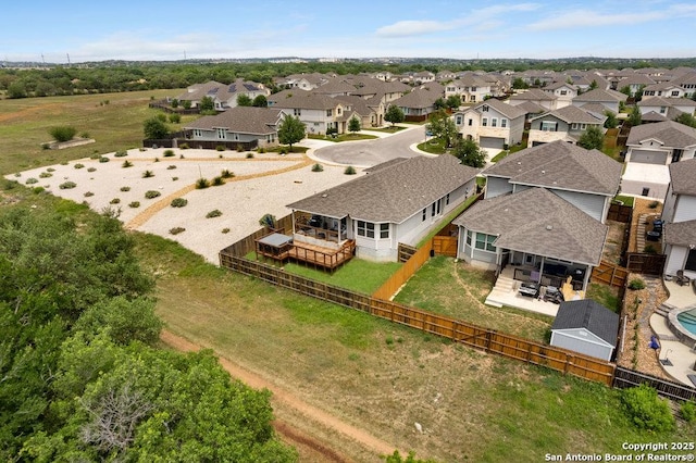 birds eye view of property with a residential view