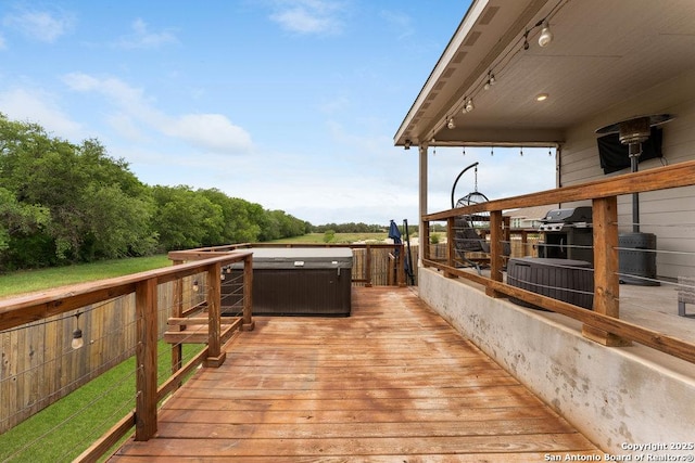 wooden terrace featuring a hot tub