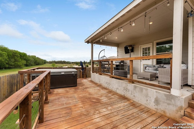 wooden terrace with a hot tub